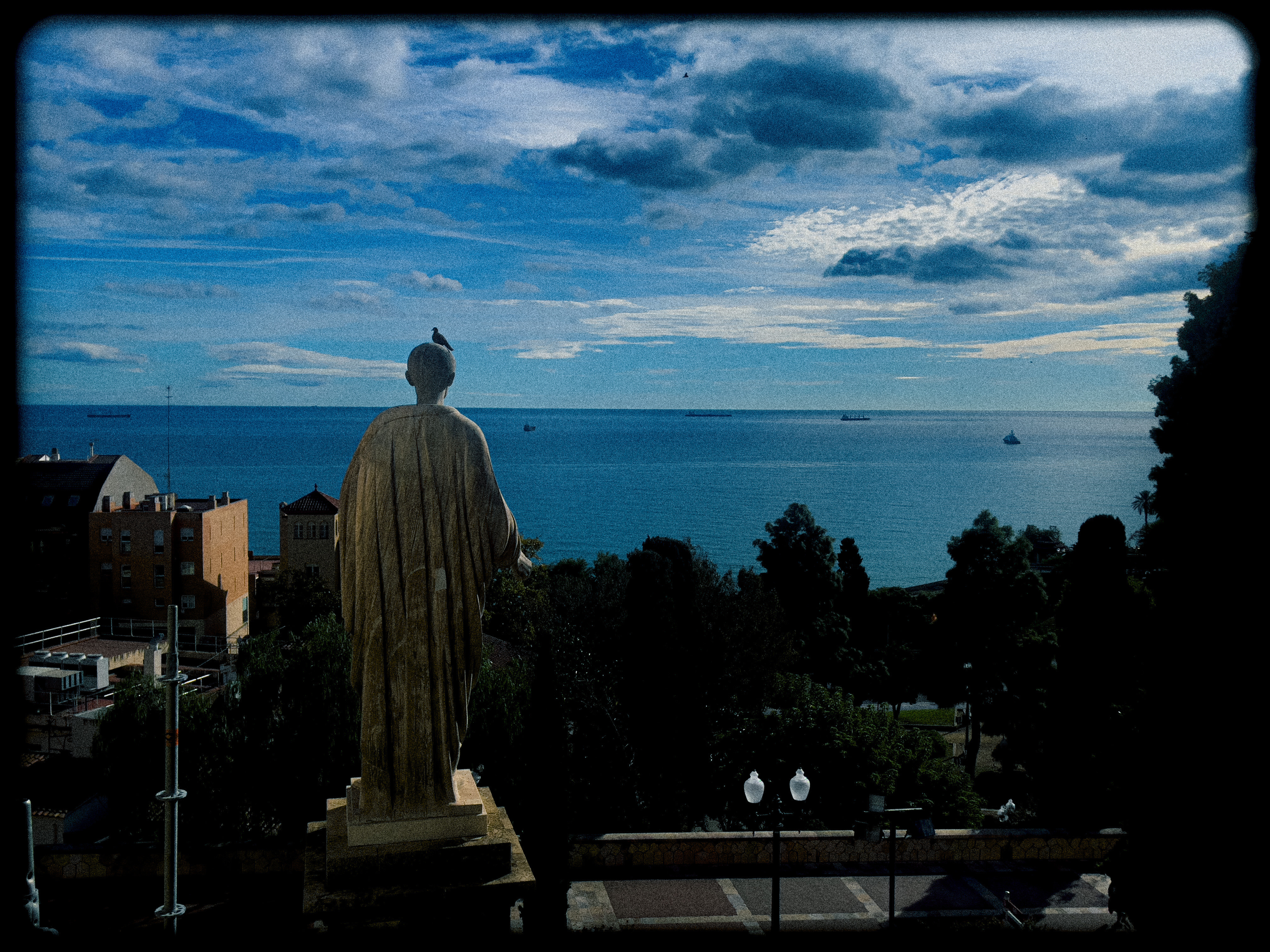 a statue overlooking the ocean