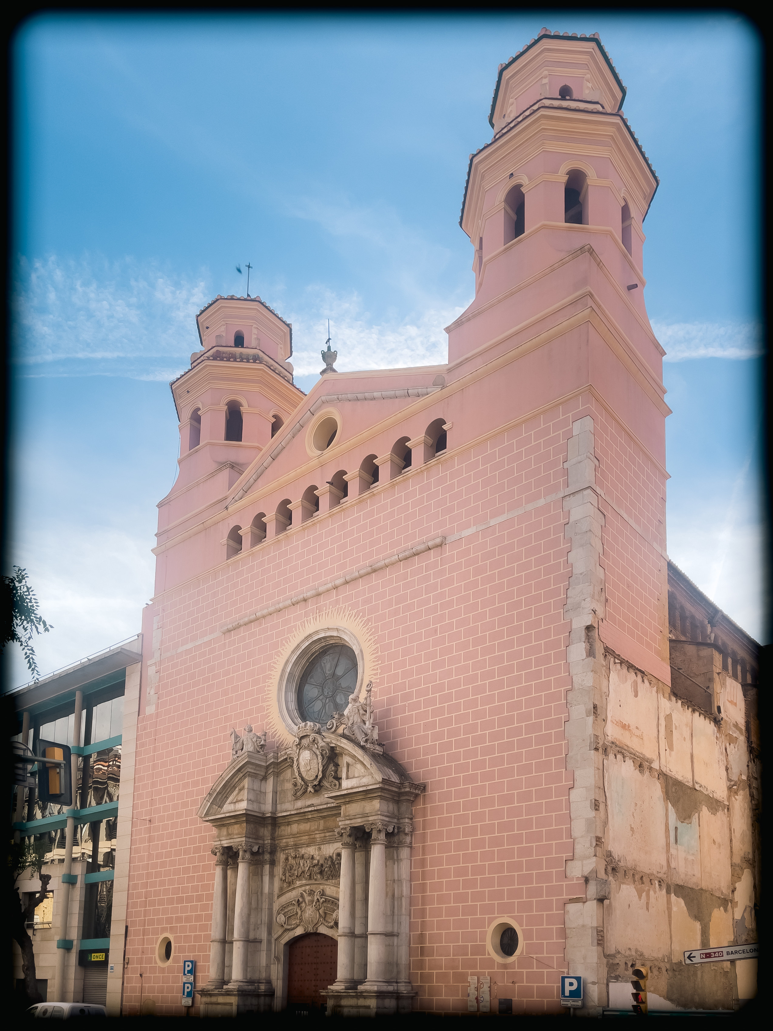 a pink church with two towers